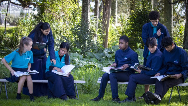 Highschool students studying outside